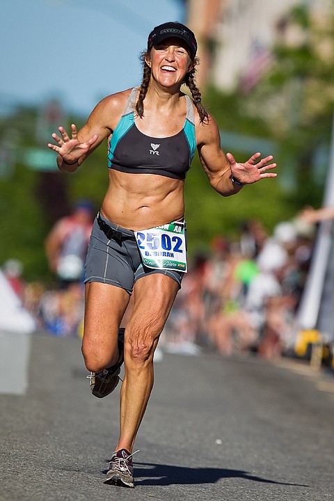 &lt;p&gt;SHAWN GUST/Press Deborah Battaglia, of Salt Lake City, celebrates prior to crossing the finish line of the Ironman Coeur d'Alene on Sunday.&lt;/p&gt;