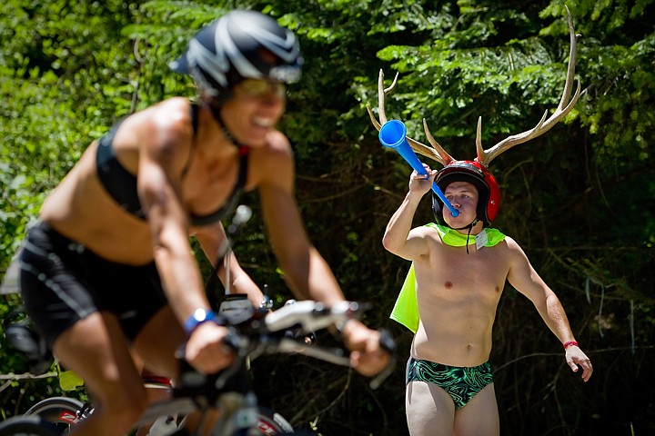 &lt;p&gt;JEROME A. POLLOS/Press Robby Astin, 19, from Hayden, motivates triathletes with his vuvuzela and his antler helmet as they ascend English Point Road.&lt;/p&gt;