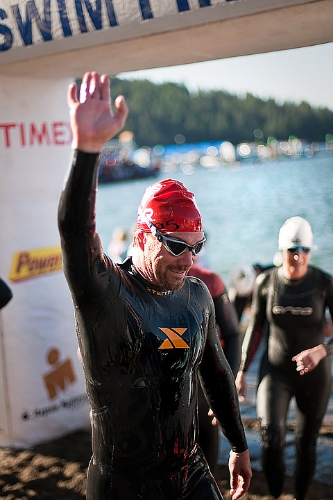 &lt;p&gt;BEN BREWER/Press Brad Miller of Fairview, NC waves to the screaming crowds coming around the first turnaround on the beach in Sunday's Ford Ironman competition.&lt;/p&gt;