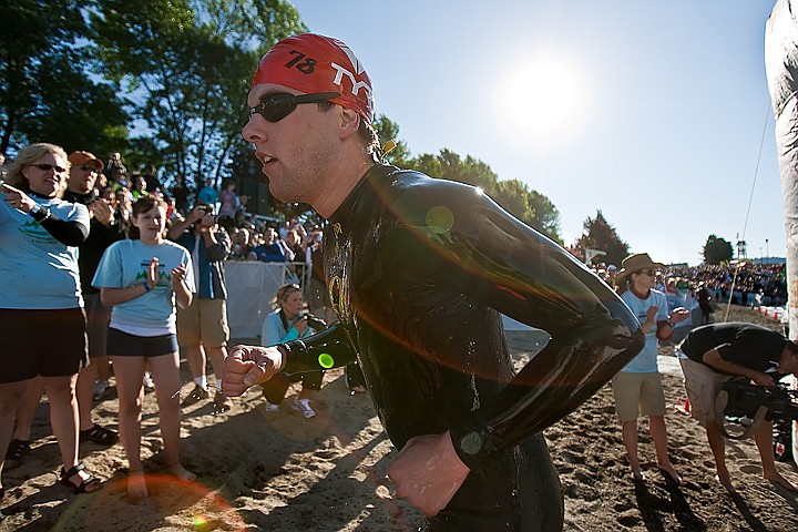 &lt;p&gt;BEN BREWER/Press An Ironman competitor rounds the corner of the first lap of swimming and is directed back into the water by volunteers during Sunday's Ford Ironman in Coeur d'Alene.&lt;/p&gt;