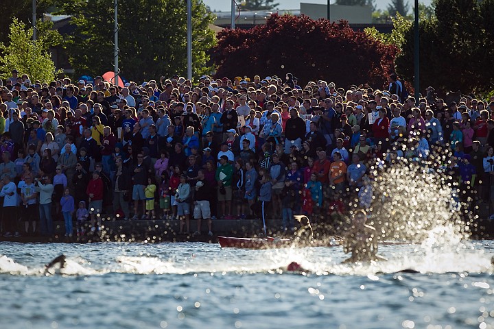 &lt;p&gt;JEROME A. POLLOS/Press Hundreds of spectators watch as the professional Ironman competitors make their way toward the beach as the athletes finish their first lap of the swim portion.&lt;/p&gt;