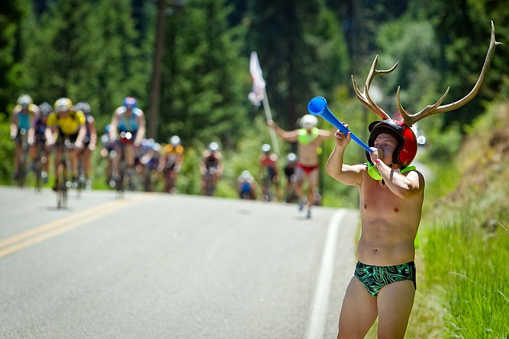 &lt;p&gt;JEROME A. POLLOS/Press Robby Astin, 19, from Hayden, motivates triathletes with his vuvuzela and his antler helmet as they ascend English Point Road.&lt;/p&gt;