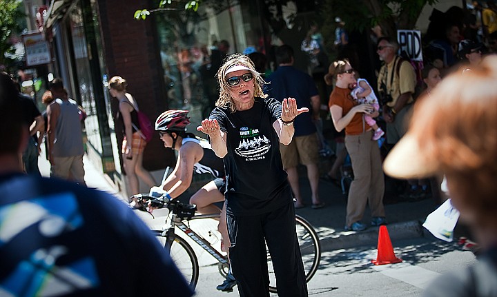 &lt;p&gt;BEN BREWER/Press Security volunteer Maia Pickering of Seattle, Washington, frantically directs pedestrian traffic during the bike portion of Sunday's Ford Ironman competition at the intersection of Fourth Street and Lakeside Avenue.&lt;/p&gt;