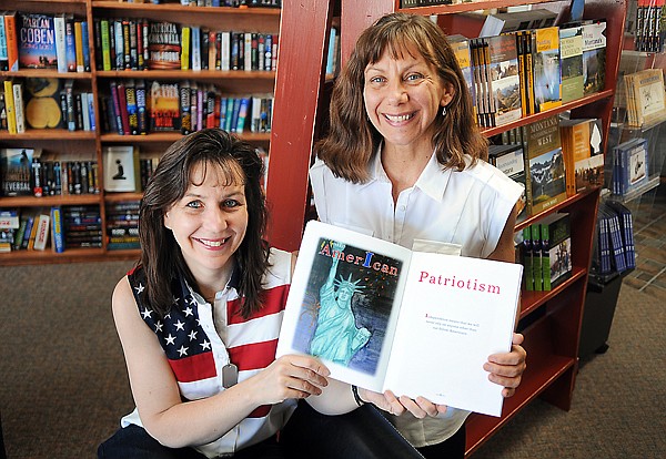 Heidi Roedel, left, and Kathleen Hawkins with the book they helped illustrate and edit, American Patriotism, on Tuesday, June 21, at the Book Shelf in Kalispell.