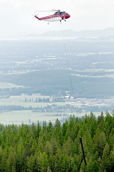 &lt;p&gt;A helicopter carries the pole of Tower Six to the WIllow Lot at
Whitefish Mountain Resort on Friday morning. The tower was removed
due to a slump in the ground that caused it to tilt.&lt;/p&gt;