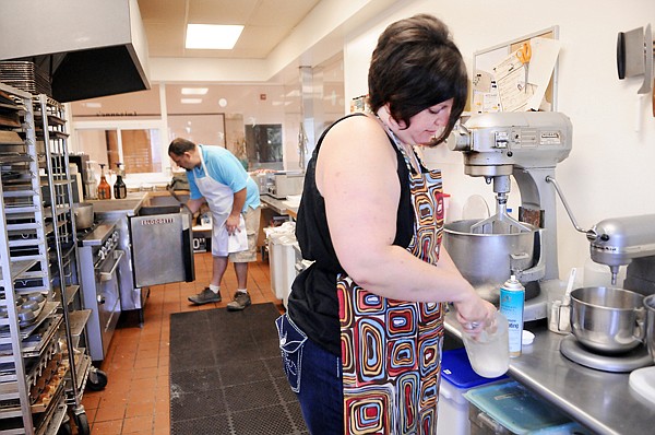 &lt;p&gt;Jennelle Cassidy whips together the Sweet NO Wheat! egg
replacement as she works on the baking for the day early Thursday
morning. In the background her husband Scott checks on a batch of
pizza crusts that are nearly ready to come out of the oven.&lt;/p&gt;