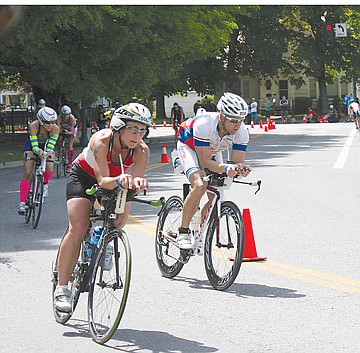 &lt;p&gt;Deanna McElwee, left, cruises past on her bike. She said biking was the most enjoyable segment of the raced.&lt;/p&gt;