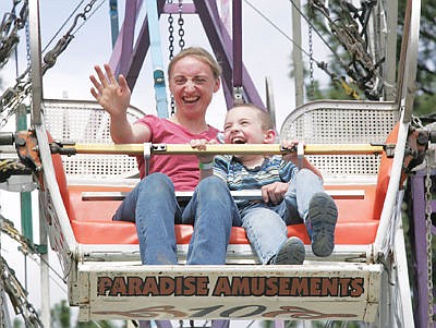 &lt;p&gt;Having a good time aboard Paradise Carnival's Ferris wheel with Charity Hedge and her son David Hedge Saturday during Logger Days 2016. (Paul Sievers/The Western News)&lt;/p&gt;