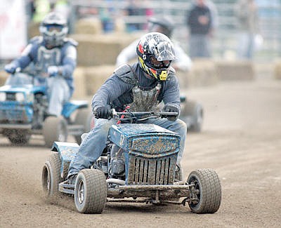 &lt;p&gt;Jeff Forster takes the checkered flag with his 20hp V-Twin Kohler in the open class 12-lap main followed by Kip Nixon and Darren Short Friday evening during Logger Days 2016. (Paul Sievers/The Western News)&lt;/p&gt;