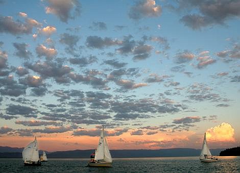 Craig Moore/Daily Inter LakeSailboats racing in Somers Bay on Flathead Lake during Tuesday night's white sail race at the North Flathead Yacht Club. Racers had a nice breeze once the evening thermal started and were able to have a race lasting about one hour. A thunderstorm can be seen forming over the Swan Lake area in the back right.