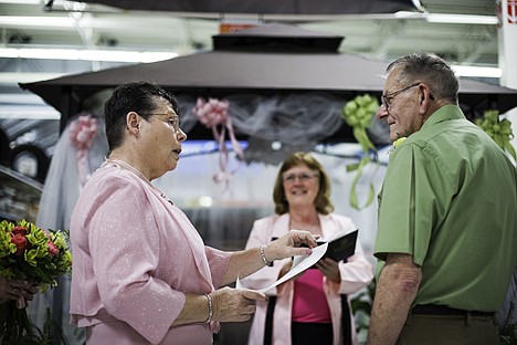 &lt;p&gt;Lois Free reads from a prepared letter describing the things she loves about Donald Evans during their wedding ceremony at Walmart.&lt;/p&gt;