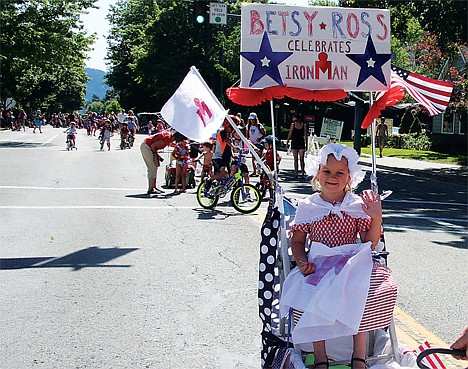 &lt;p&gt;Elsa Laker, 4, of Coeur d'Alene rode on a homemade float and dressed up as Betsy Ross for the parade, in this 2013 file photo.&lt;/p&gt;