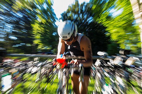 &lt;p&gt;Mens 18-24 age group triathlete Krishnan Rajagopalan makes adjustments to his bike before setting out on the bicycle course on Sunday.&lt;/p&gt;