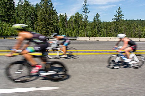 &lt;p&gt;Cyclists ride along Highway-95 during the Coeur d'Alene Ironman on Sunday.&lt;/p&gt;