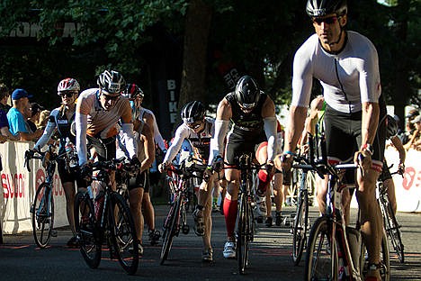 &lt;p&gt;Bikers leave the staging area and begin the 112-mile bike ride during the Coeur d'Alene Ironman on Sunday.&lt;/p&gt;