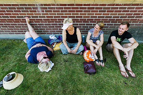 &lt;p&gt;While waiting for her son to race past, Debbie Bailey, far left, lays in the grass in a spot of shade while family and friends, Krissy Catt, Lauren Bailey, second from right, and Steven Lillig take reprieve from scorching temperatures on Sunday.&lt;/p&gt;