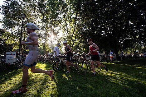 &lt;p&gt;As the sun rises Sunday morning Ironman participants transition from the swim to bike ride.&lt;/p&gt;