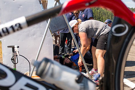 &lt;p&gt;Scott Volon lays on the ground while receiving medical attention during the bike portion of the Coeur d'Alene Ironman on Sunday. Volon did not finish the race.&lt;/p&gt;