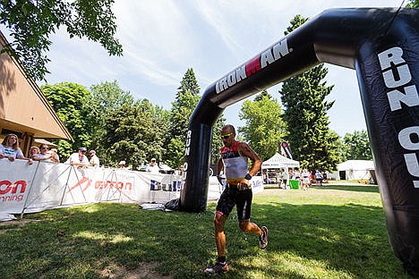 &lt;p&gt;Pedro Gomes, of Scottsdale, AZ, pours water on his lower half as he begins the run portion of Ironman Coeur d&#146;Alene on Sunday.&lt;/p&gt;