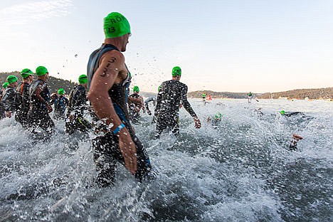 &lt;p&gt;Henry Tragle, of the mens 35-39 division, runs into the water at the beginning of the 2015 Coeur d'Alene Ironman on Sunday.&lt;/p&gt;