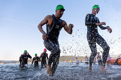 &lt;p&gt;Age group competitors come out of the water on their first lap of the 2.4-mile swim.&lt;/p&gt;