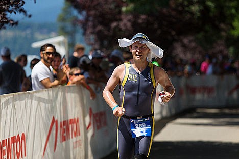 &lt;p&gt;Rory Duckworth, of Bluffdale, UT, races along the run course as fans cheer.&lt;/p&gt;