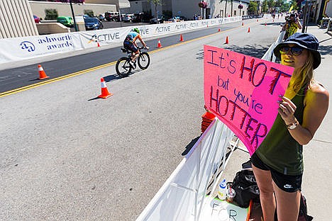 &lt;p&gt;Bethany Lobaza, of Arizona, holds a sign while waiting for her sister, an Ironman Coeur d&#146;Alene competitor, to pass.&lt;/p&gt;