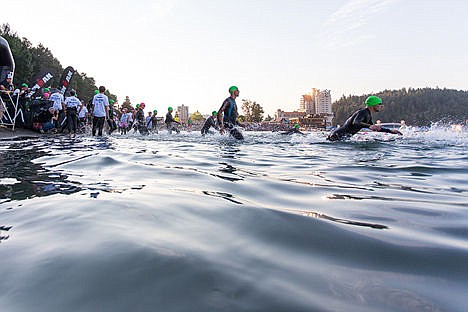 &lt;p&gt;Swimmers dive in the Lake Coeur d'Alene at the beginning of the Coeur d'Alene Ironman on Sunday.&lt;/p&gt;