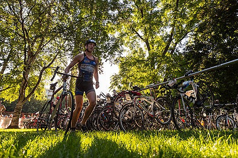 &lt;p&gt;Krishna Rajagopalan walks his bike out of the bike staging area during the Coeur d'Alene Ironman on Sunday. Rajagopalan did not finish.&lt;/p&gt;