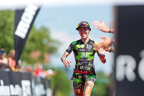 &lt;p&gt;Heather Jackson high-fives fans as she enters the finish line of the Coeur d'Alene Ironman on Sunday.&lt;/p&gt;