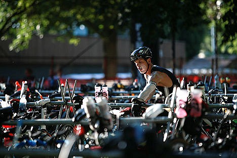 &lt;p&gt;A triathlete painted in sunscreen locates their bike amongst a sea of others.&lt;/p&gt;