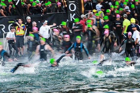 &lt;p&gt;Ironman participants get a start at the triathlon Sunday morning taking off to swim at Coeur d&#146;Alene City Beach.&lt;/p&gt;