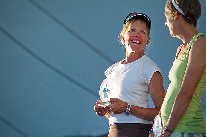 &lt;p&gt;Kathleen Salvadore, of Hayden Lake, chats with a fellow competitor after being awarded a fourth place trophy in the women's age 55-59 division during Monday's award banquet.&lt;/p&gt;