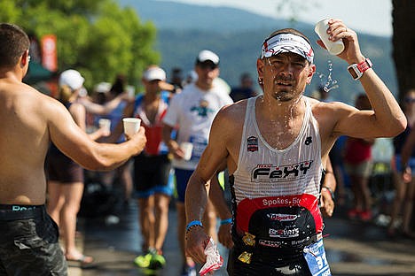 &lt;p&gt;Ironman triathlete Jason Davidson of Springfield, Va., pours cold water on his head while running through an aid station on Coeur d&#146;Alene Lake Drive.&lt;/p&gt;