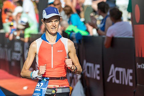 &lt;p&gt;Jenna Rings, top local female finisher, walks across the finish line after completing the Coeur d'Alene Ironman in 12:22:49.&lt;/p&gt;