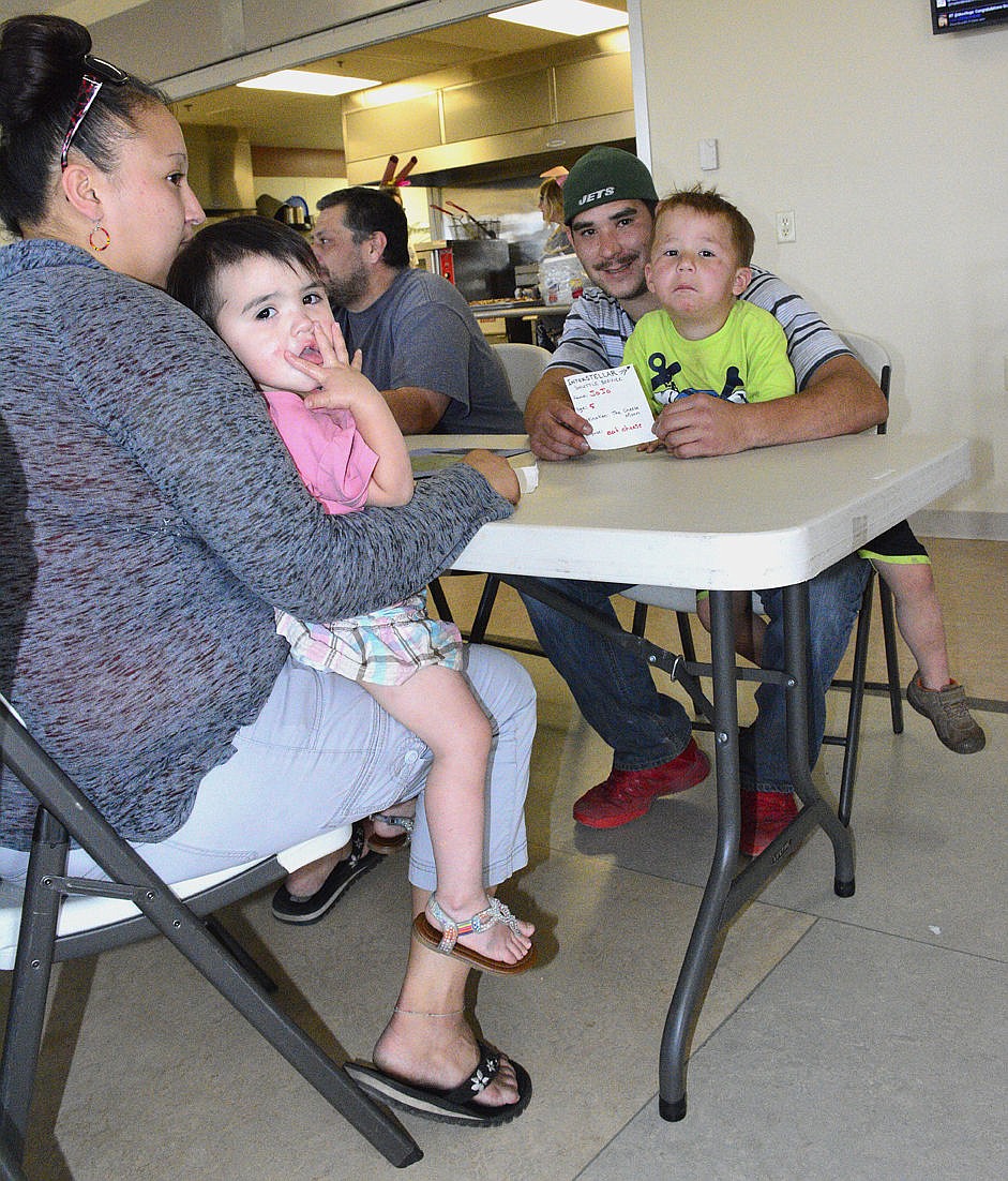 &lt;p&gt;&lt;strong&gt;Left to right, Andrea Hammer, Helen Couture, 1, Travis Couture and Joseph Couture, 4, wait patiently while space leaders call tables to a food line behind them.&#160;&lt;/strong&gt;&lt;/p&gt;&lt;p&gt;&lt;strong&gt;&#160;&lt;/strong&gt;&lt;/p&gt;