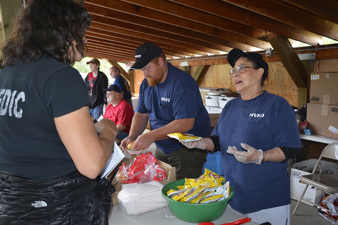 &lt;p&gt;&lt;strong&gt;Auxiliary members Matt Hout, left, and Tootie Lemon hand out buns and conversation at the picnic Saturday.&lt;/strong&gt;&lt;/p&gt;&lt;p&gt;&lt;strong&gt;&#160;&lt;/strong&gt;&lt;/p&gt;