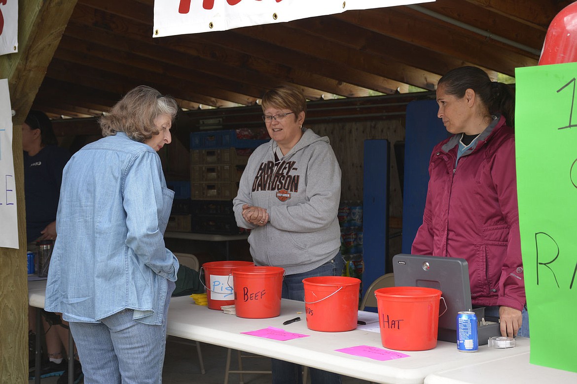 &lt;p&gt;&lt;strong&gt;Mission Volunteer Fire Department Auxiliary members Rachel Gould, left, and Joni Uhe explain to a picnic-goer what the chosen raffle ticket will win.&#160;&lt;/strong&gt;&lt;/p&gt;&lt;p&gt;&lt;strong&gt;&#160;&lt;/strong&gt;&lt;/p&gt;