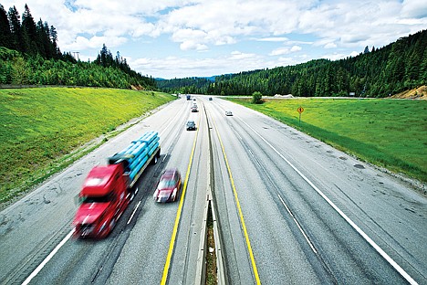 &lt;p&gt;Motorists drive over the crest of Fourth of July Pass on Interstate 90 on Friday. Both the weather forecast and gas prices appear favorable for holiday travelers.&lt;/p&gt;