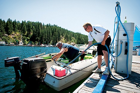 &lt;p&gt;Dock attendant Jake Donahue lends a hand to Scott Reid, of Coeur d'Alene, as he removes the nozzle from the gas tank of his boat after filling up Tuesday before taking to the waters of Lake Coeur d'Alene.&lt;/p&gt;