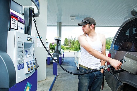 &lt;p&gt;Kyle Weskamp of Spokane fills up at the Tesoro gas station on Sherman Avenue on his way to Fernan Lake, where he plans to stay through the Fourth of July.&lt;/p&gt;