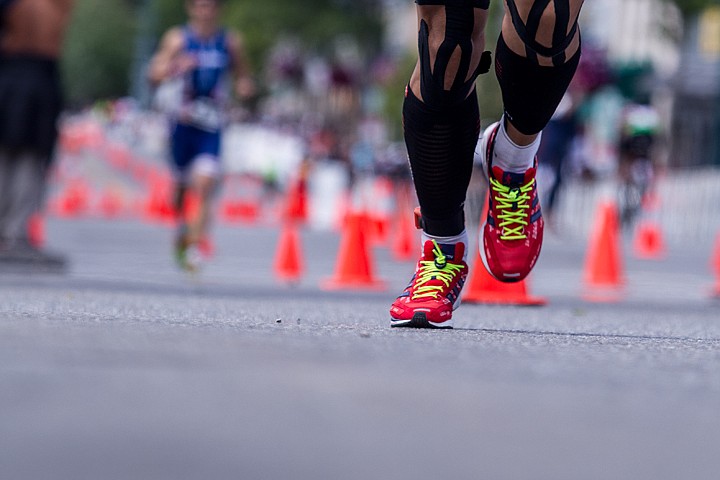 &lt;p&gt;JAKE PARRISH/Press&lt;/p&gt;&lt;p&gt;A participant's red shoes brighten the Ironman race in Coeur d'Alene on Sunday.&lt;/p&gt;