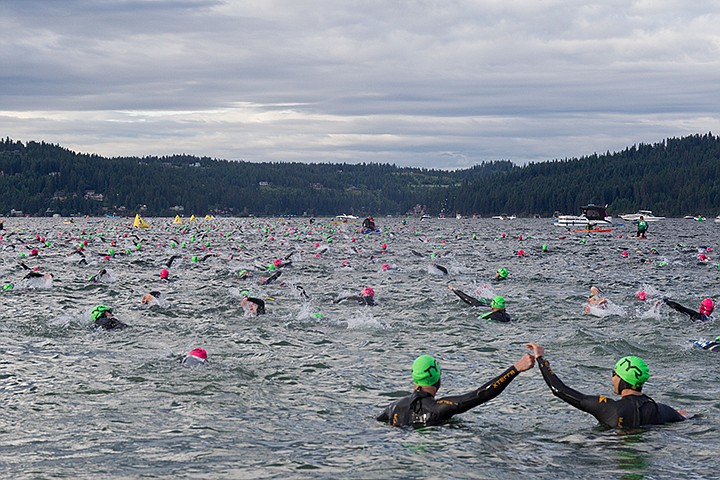 &lt;p&gt;MIKE CURRY/Press&lt;/p&gt;&lt;p&gt;Two age group competitors high-five each other prior to beginning the 2.4-mile swim in Lake Coeur d&#146;Alene.&lt;/p&gt;