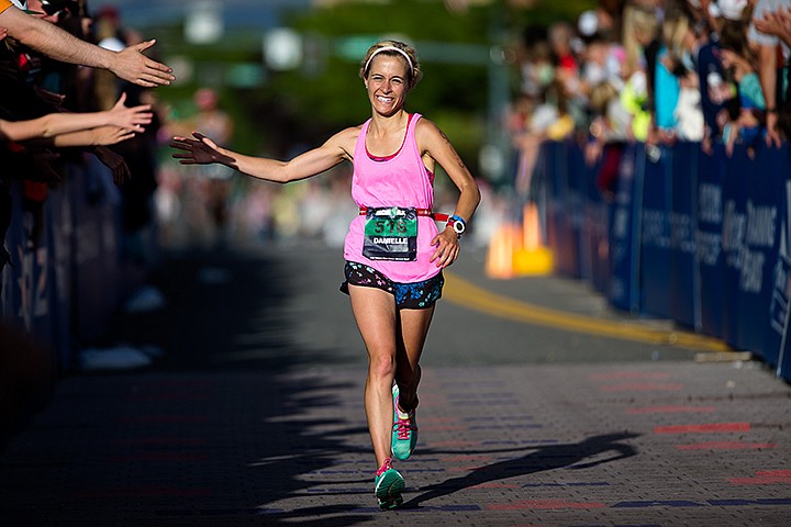 &lt;p&gt;TESS FREEMAN/Press&lt;/p&gt;&lt;p&gt;Danielle Parks of Coeur d&#146;Alene sprints towards the finish line to complete her third Ironman Coeur d&#146;Alene with a time of 12:04:09 on Sunday evening.&lt;/p&gt;