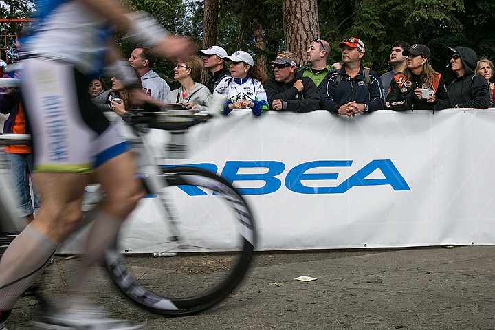 &lt;p&gt;JAKE PARRISH/Press&lt;/p&gt;&lt;p&gt;Spectators watch Ironman athletes leave the bike staging area to begin their 112 mile biking leg of the triathlon on Sunday in Coeur d'Alene.&lt;/p&gt;