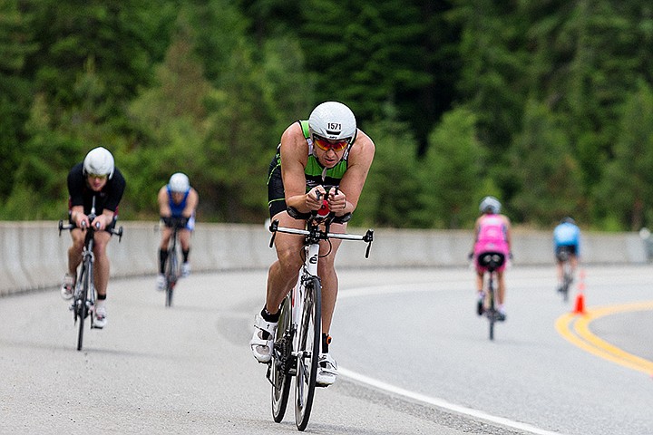 &lt;p&gt;SHAWN GUST/Press&lt;/p&gt;&lt;p&gt;Chris Driver, of Sun City, Arizona, tucks in over his handlebars while negotiating a curve on the Ironman bicycle course on U.S. 95.&lt;/p&gt;