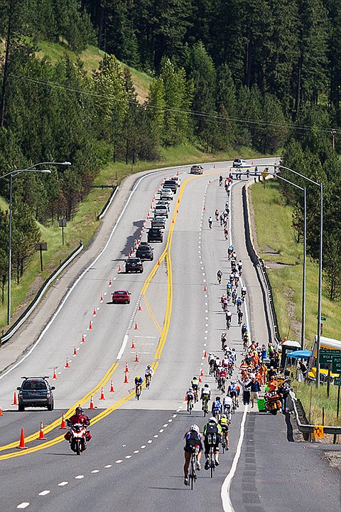 &lt;p&gt;SHAWN GUST/Press&lt;/p&gt;&lt;p&gt;Triathletes climb a grade alongside motorists near Mica Bay Sunday on U.S. 95.&lt;/p&gt;