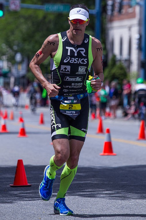 &lt;p&gt;JAKE PARRISH/Press&lt;/p&gt;&lt;p&gt;Five-time Ironman winner Andy Potts makes headway down Lakeside Avenue on his second leg of the running portion of the triathlon on Sunday. Potts went on to the win 2014 Ironman Coeur d'Alene.&lt;/p&gt;