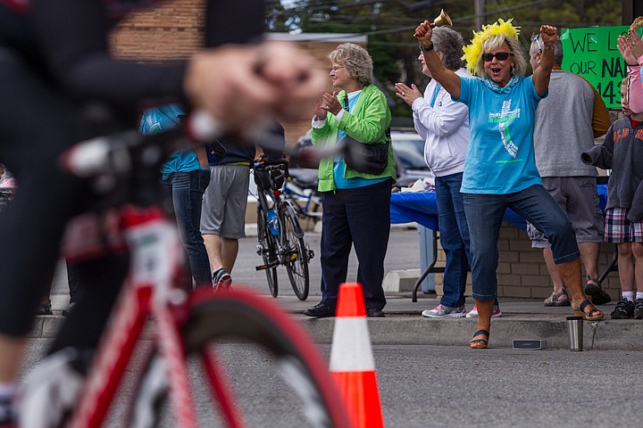 &lt;p&gt;JAKE PARRISH/Press&lt;/p&gt;&lt;p&gt;Suzy Jolley give Ironman participants words of encouragement near the First Presbyterian Church on Lakeside Avenue during the bike section of Sunday's triathlon.&lt;/p&gt;