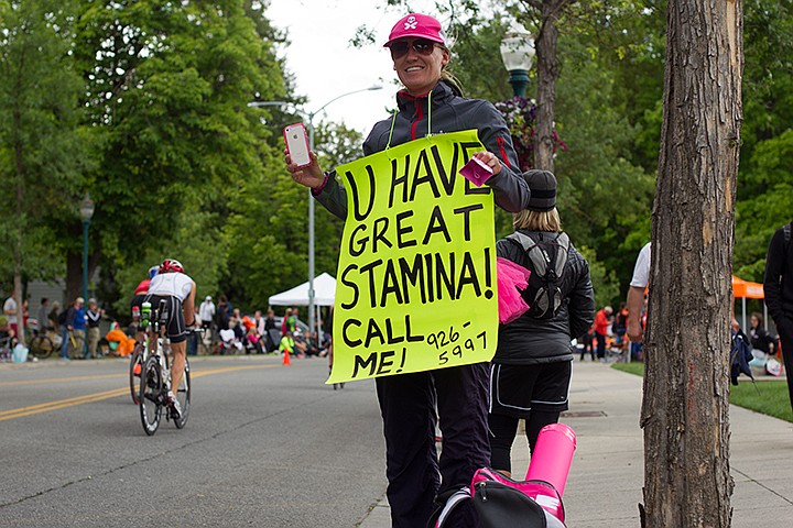 &lt;p&gt;MIKE CURRY/Press&lt;/p&gt;&lt;p&gt;Amy Ellet, 33, from Calgary, Canada, displays sign while cheering on athletes as they race passed along Lakeside Ave.&lt;/p&gt;